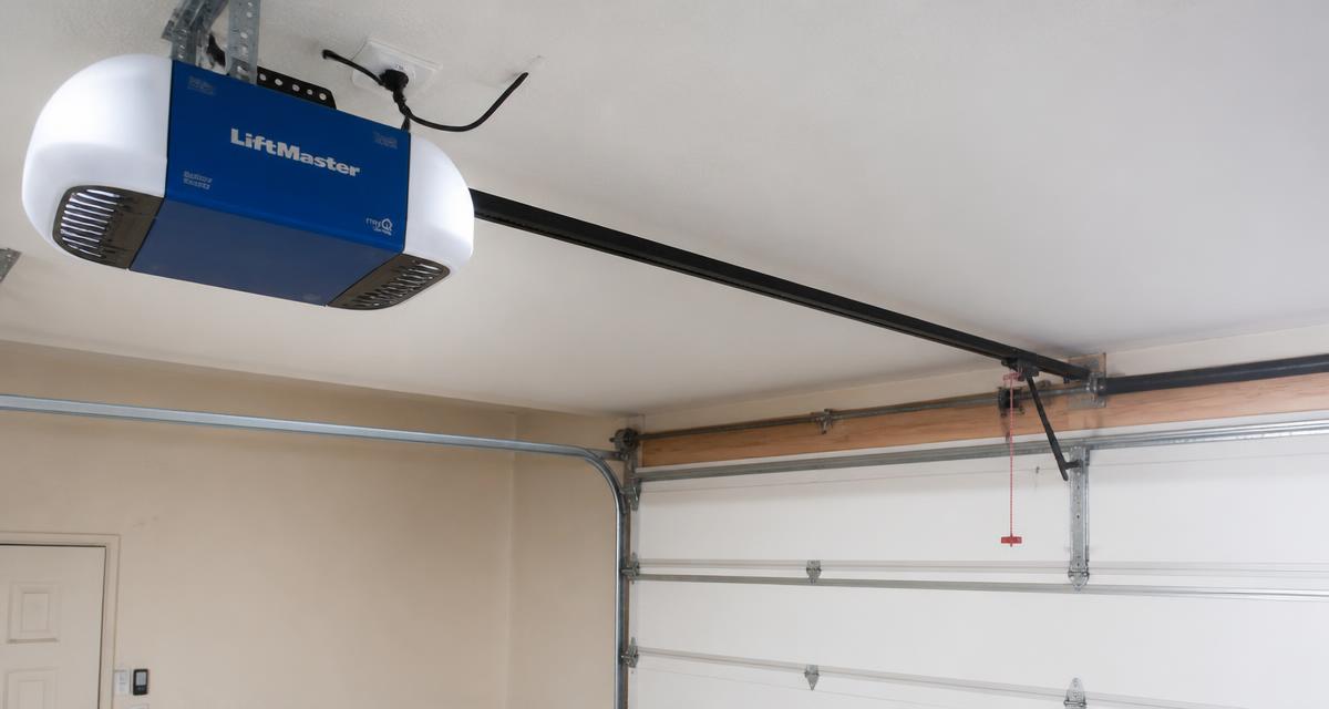 Ceiling-mounted garage door opener motor unit with belt rail and trolley above a closed garage door